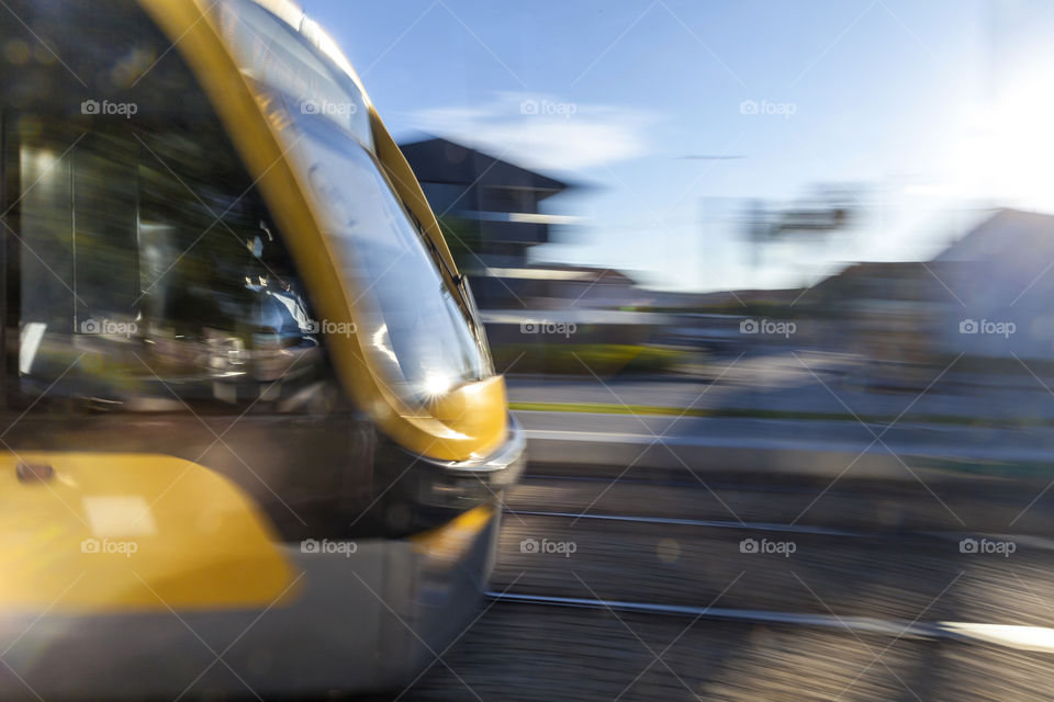 Modern metro tram in Porto speeding up