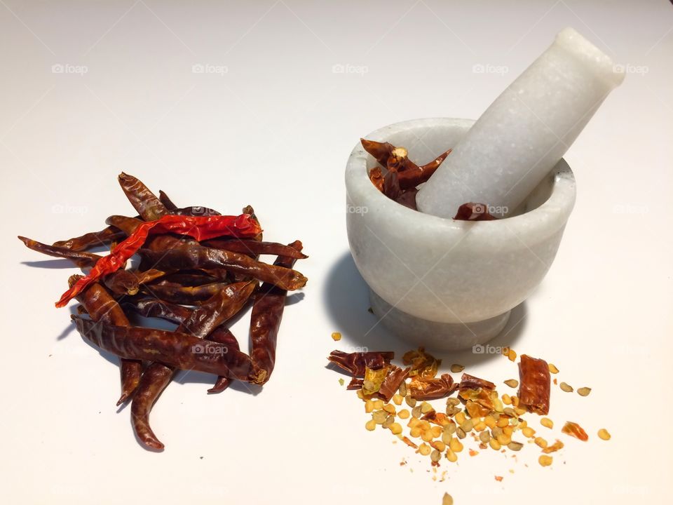 Dried red chillies in pestle