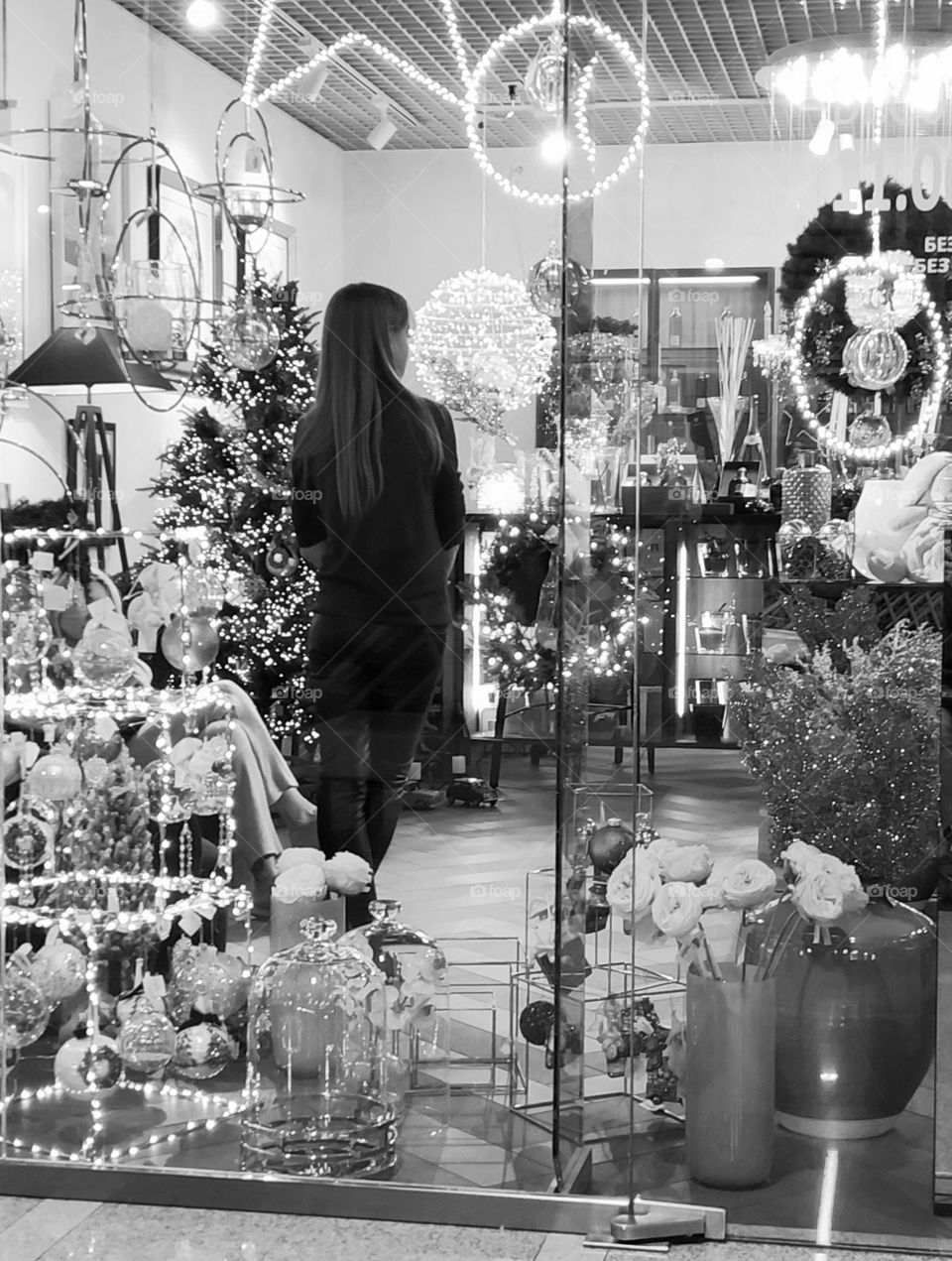 The girl in the window. Holiday atmosphere. Black and white photo