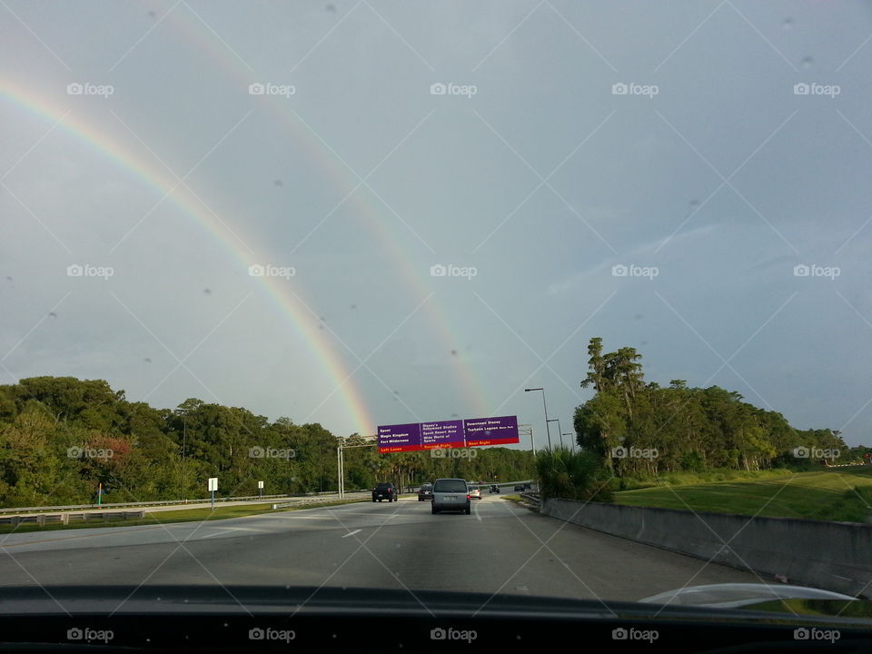 Rainbow over Disney . driving into Disney. hoping the gold of happiness is at the end of that Rainbow 