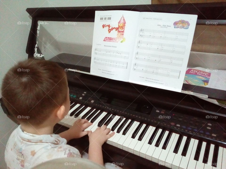 Child playing piano