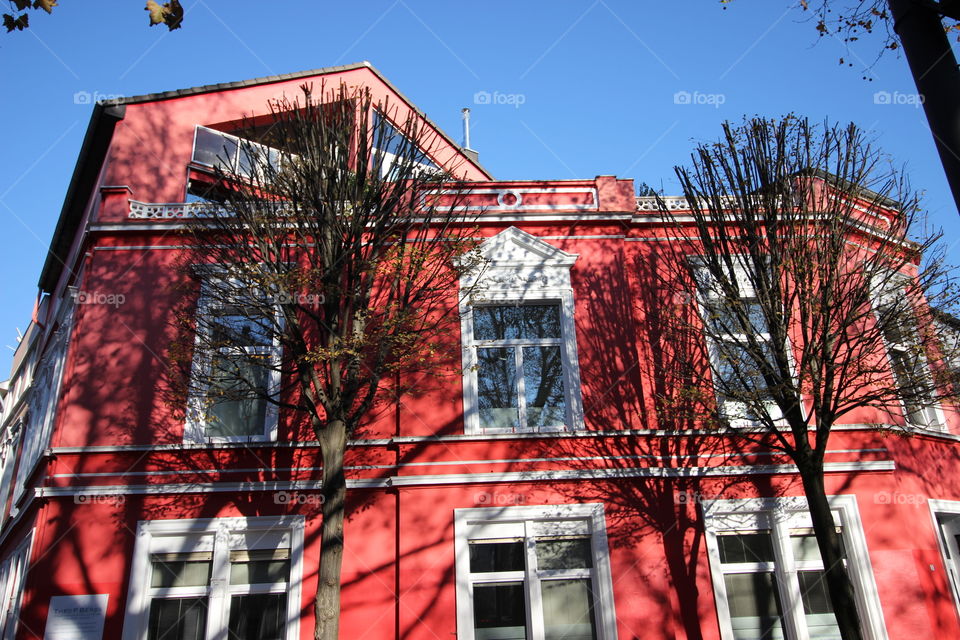 Red house in the sun