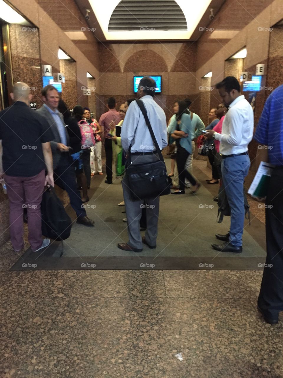 Crowded office elevator