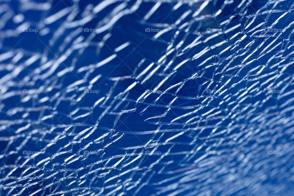 Blue cracked window glass damage situation be careful abstract background