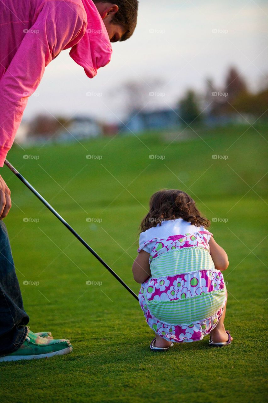 Daddy and Daughter Golfing