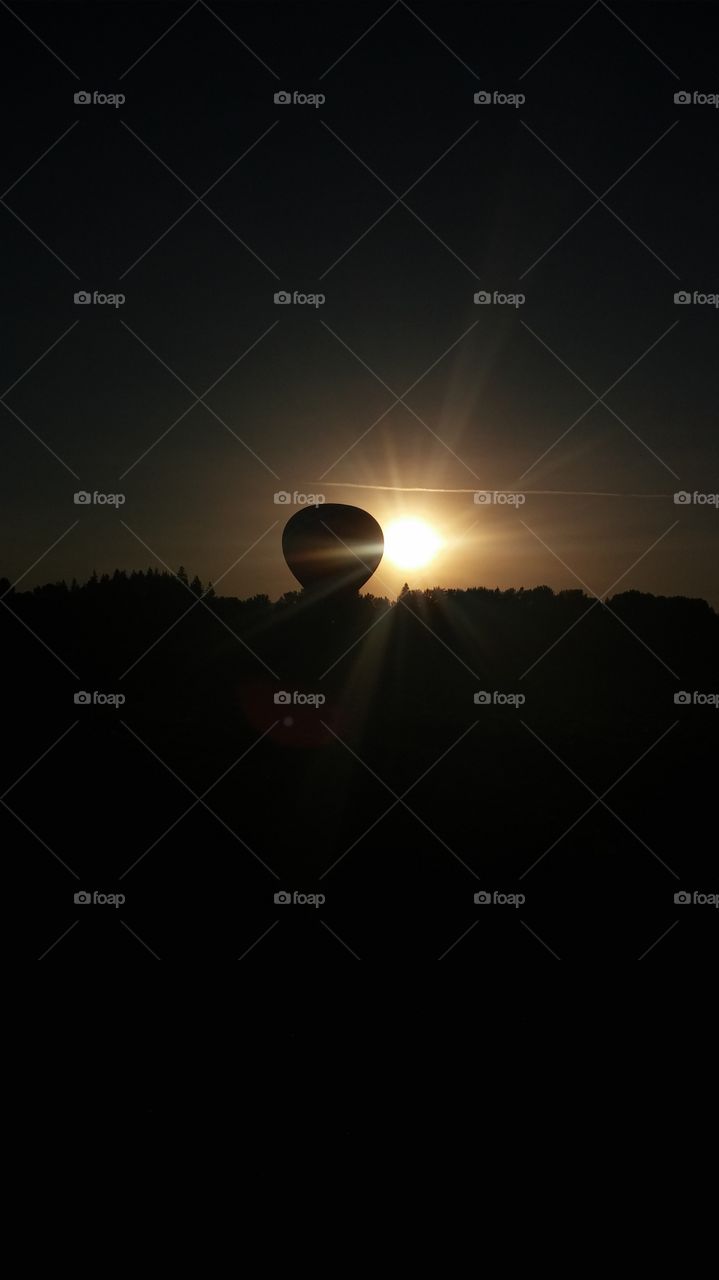 sunrise behind Hot Air Balloon