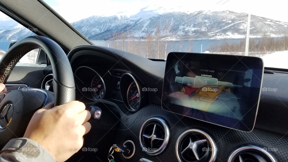 Driving a car alongside Fjord