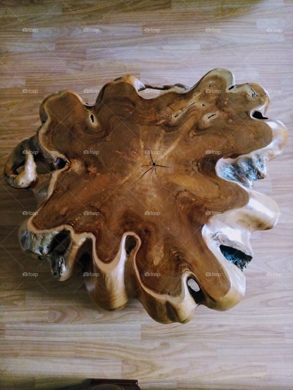 an amazing shapes of table that's made from wood.