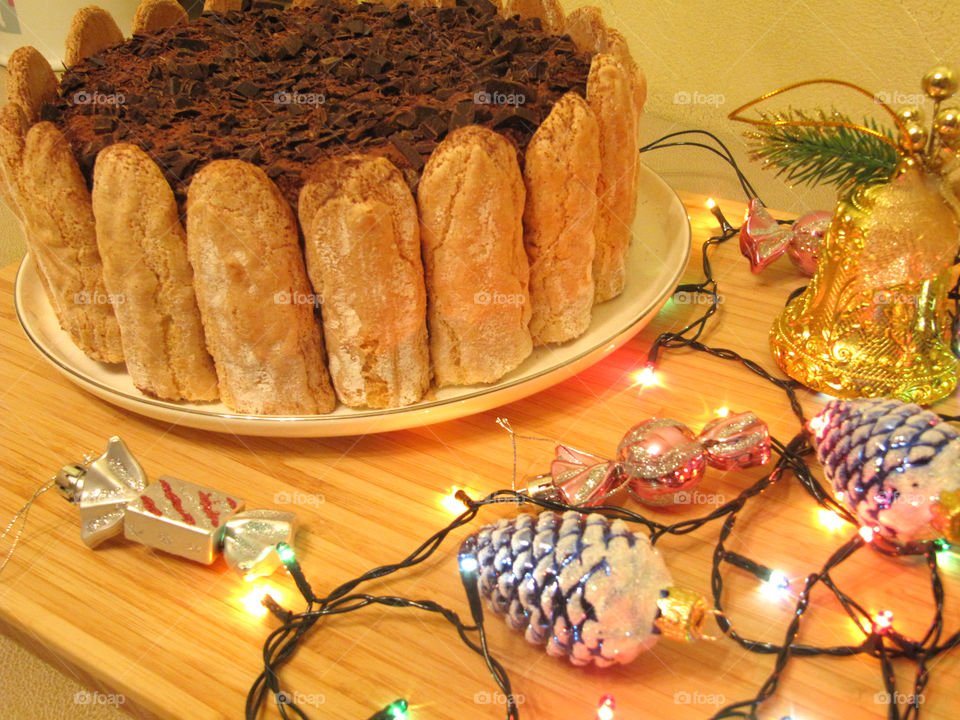 Tiramisu cake with sweet coffe and white cheesy cream and savoyardi cookies