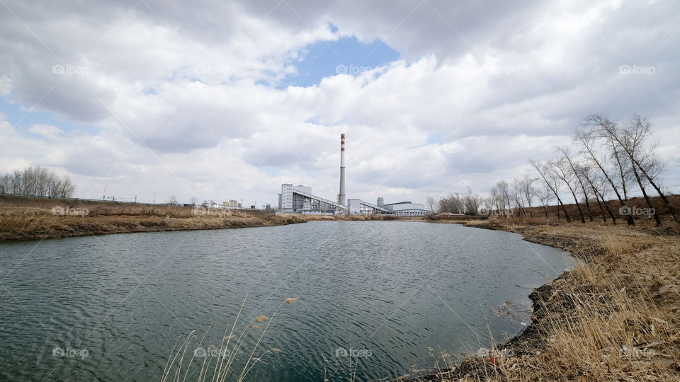 the factory near the lake in autumn