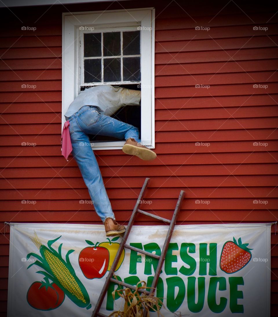 Fake man climbing in window