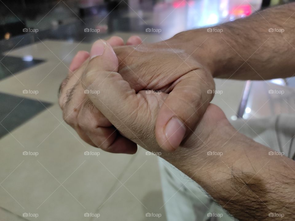 Right hand on the left hand