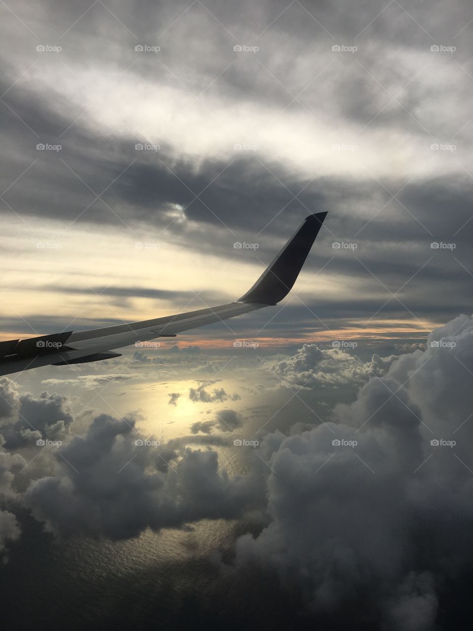 Flying into an island in the Indian Ocean the clouds were quite grey. 