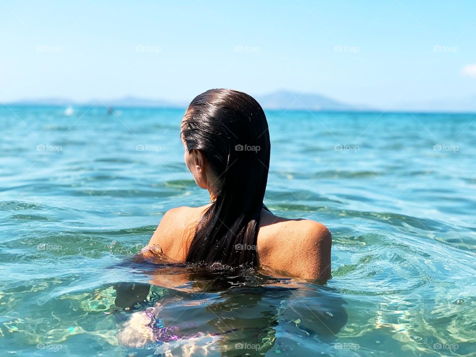 Young woman at the seaside 