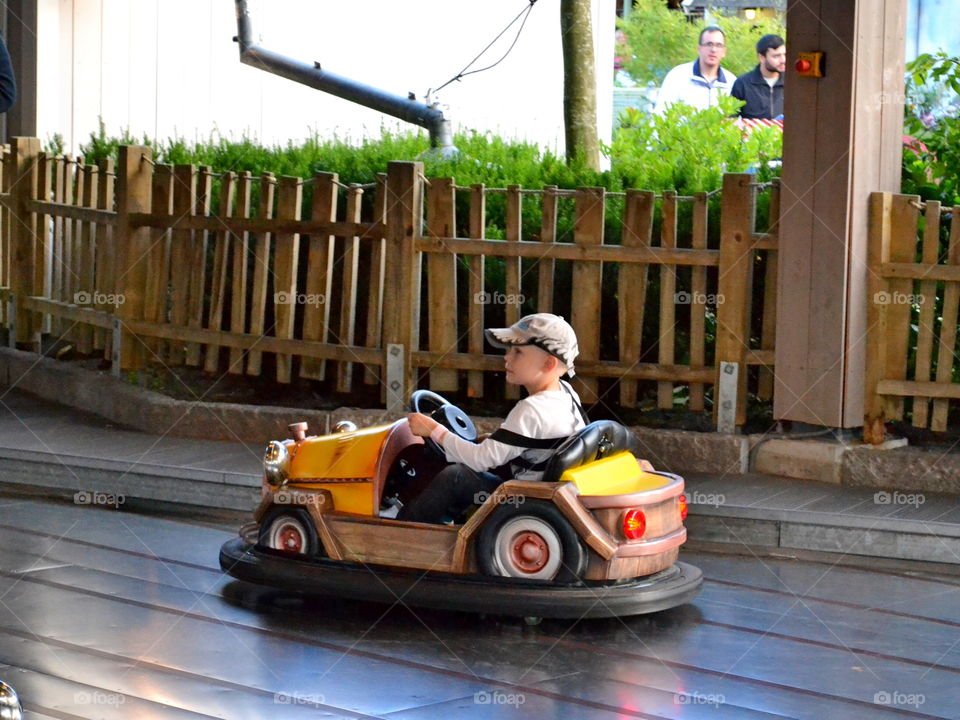 Boy driving a bumber car