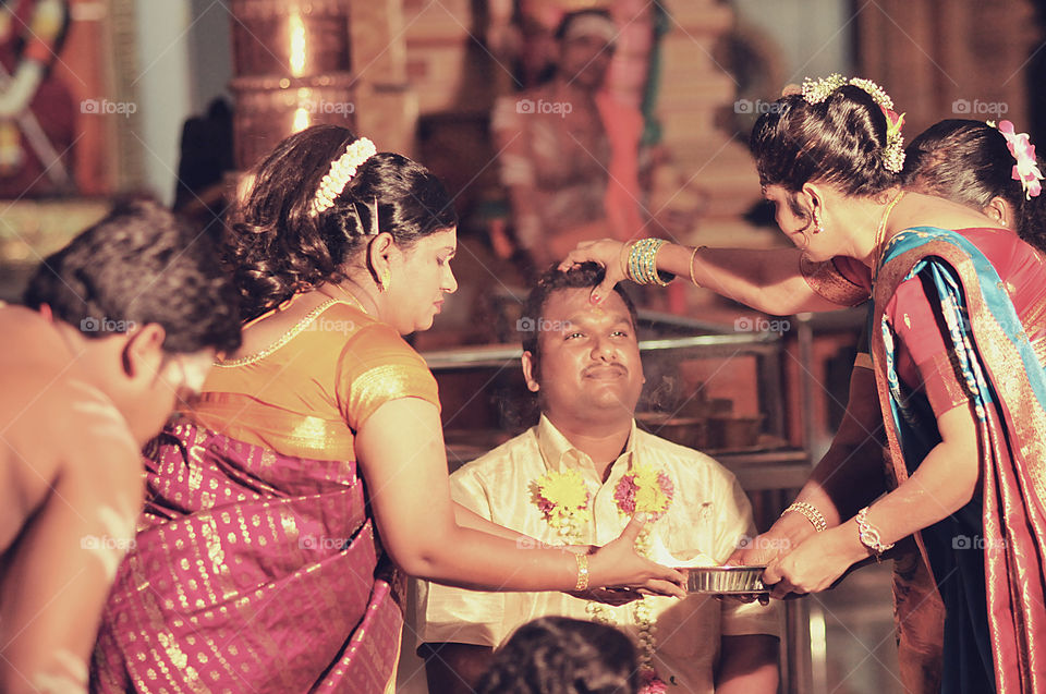 People at a hindu wedding ceremony