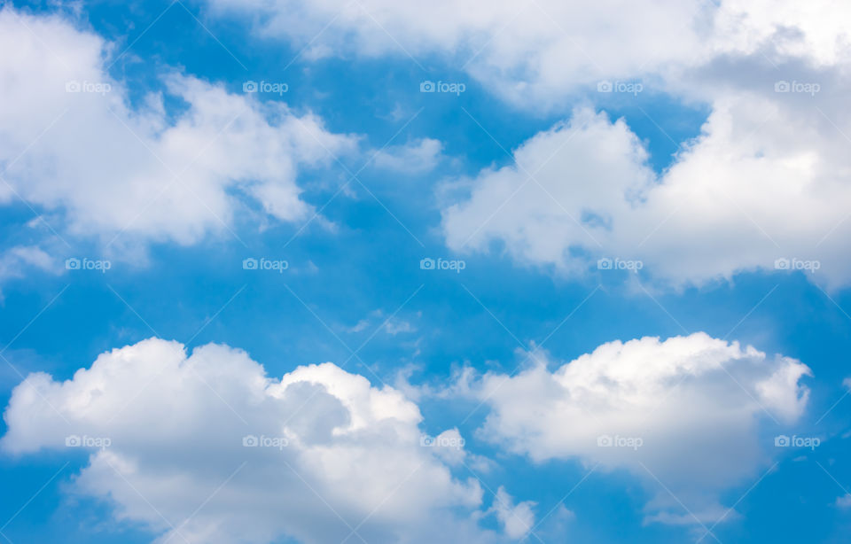 The beauty of the sky with clouds and the sun.