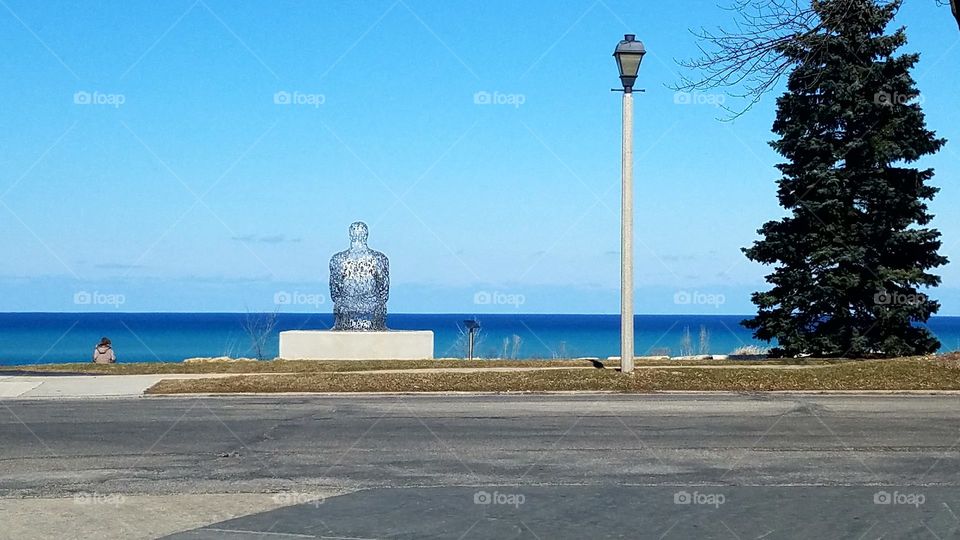 statue by lake