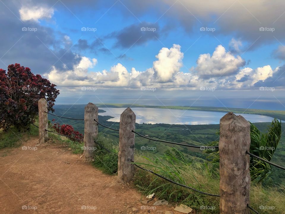 Top view of the landscape with lake and sea on the horizon