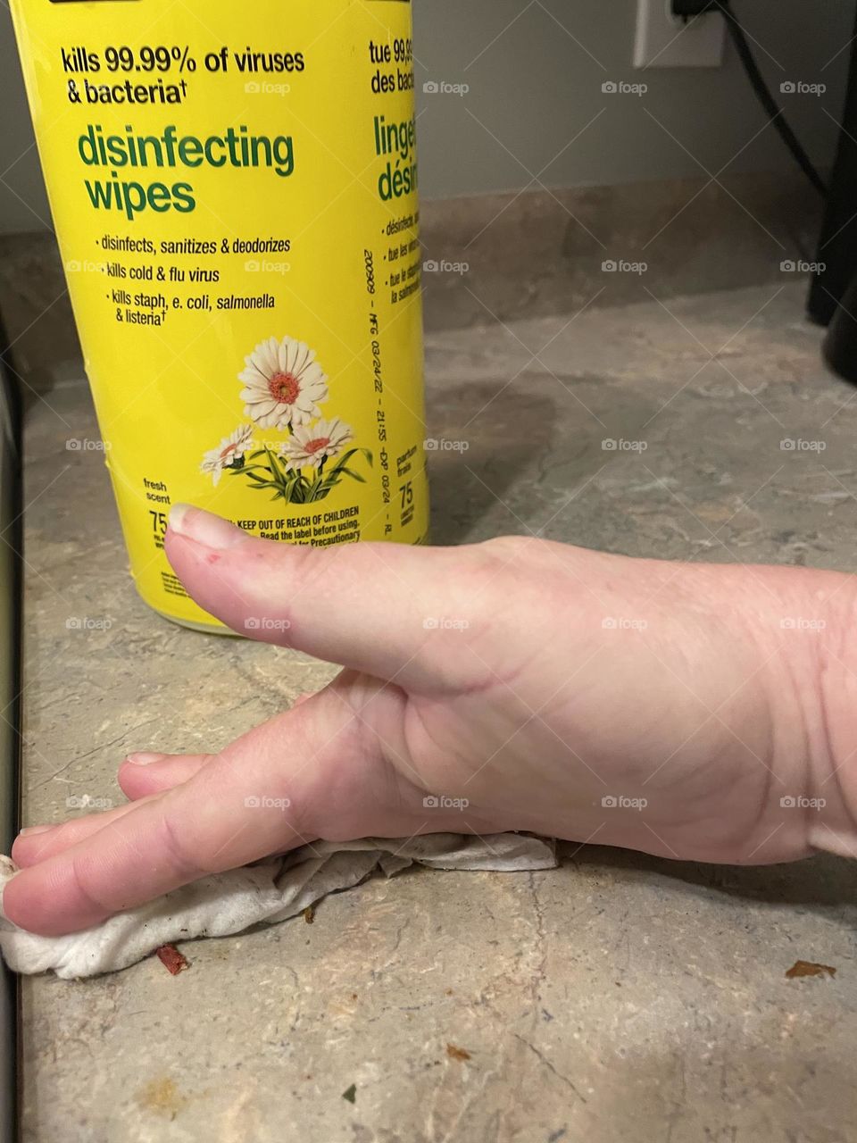 Promoting No name disinfecting wipes, this middle aged lady lifted her hand, while cleaning her counter, so we can see all the dirt and grim it collected