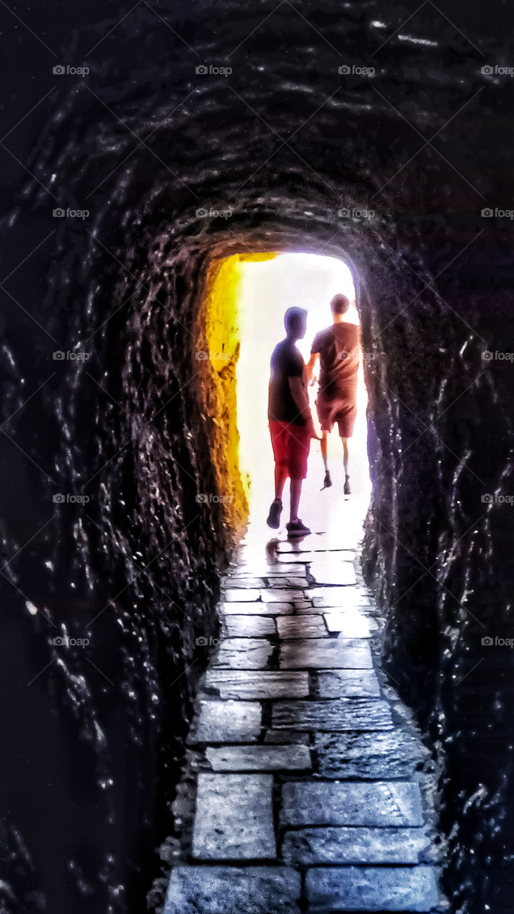 Exiting a tunnel on a trail ascending a monastery in Meteora,Greece