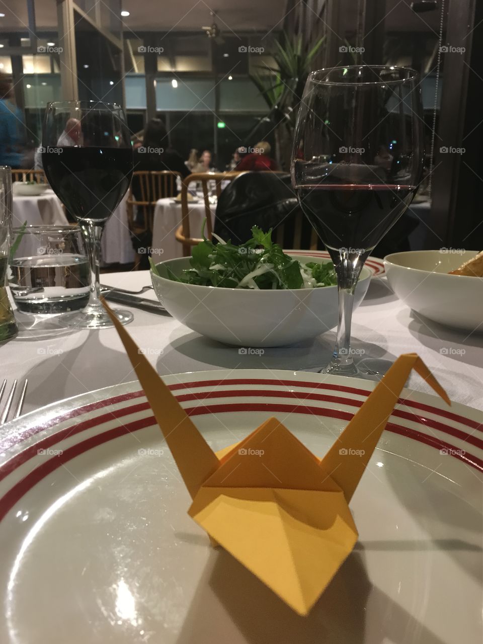 Japanese fine dining, origami paper crane on plate at place setting