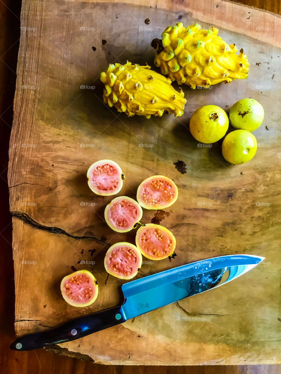 Dragonfruit and passion fruit (Lilikoi) being prepared in the kitchen.