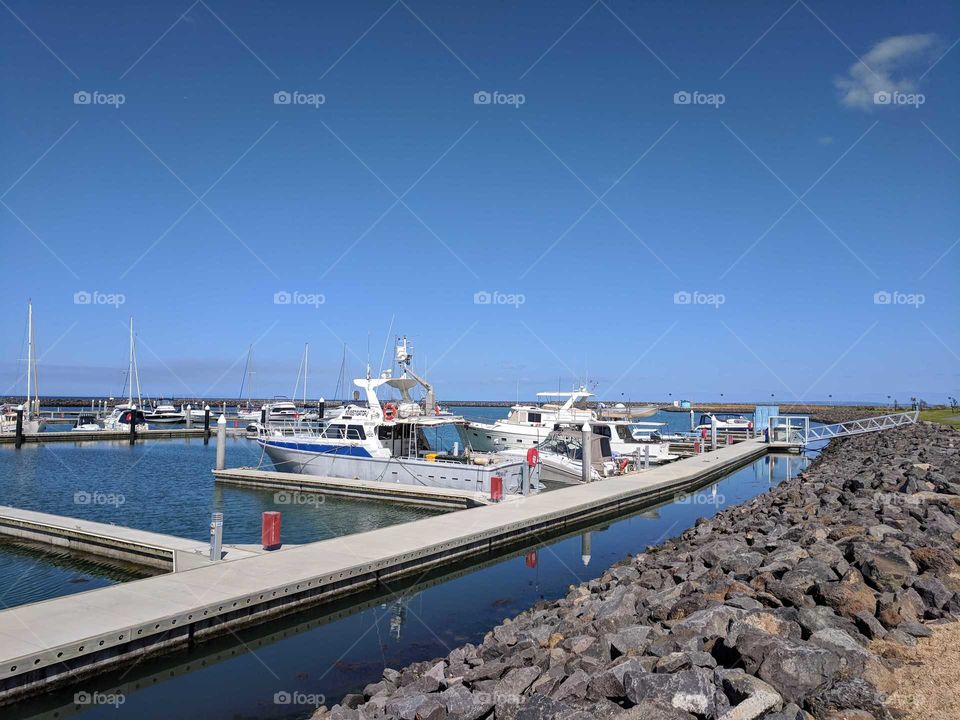 Boats taking it easy by the seaside harbour