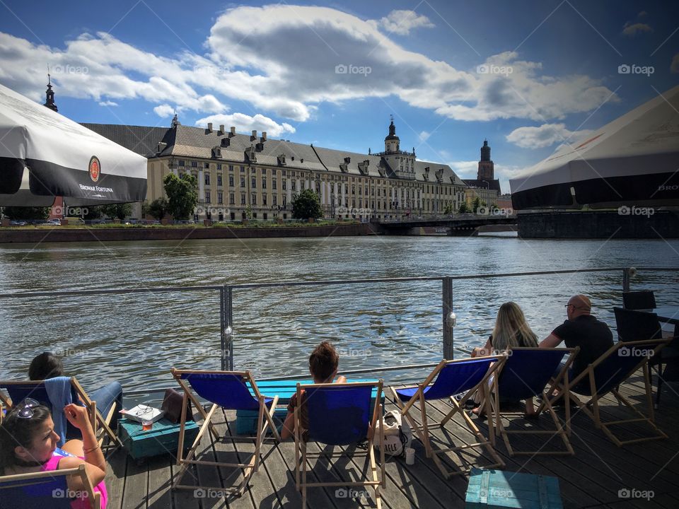 Sunbathing at the Odra river in Wroclaw 