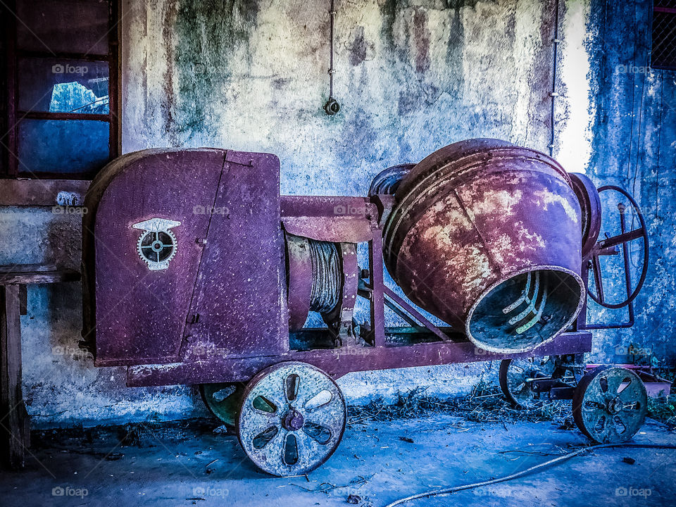 An old rusty cement mixer