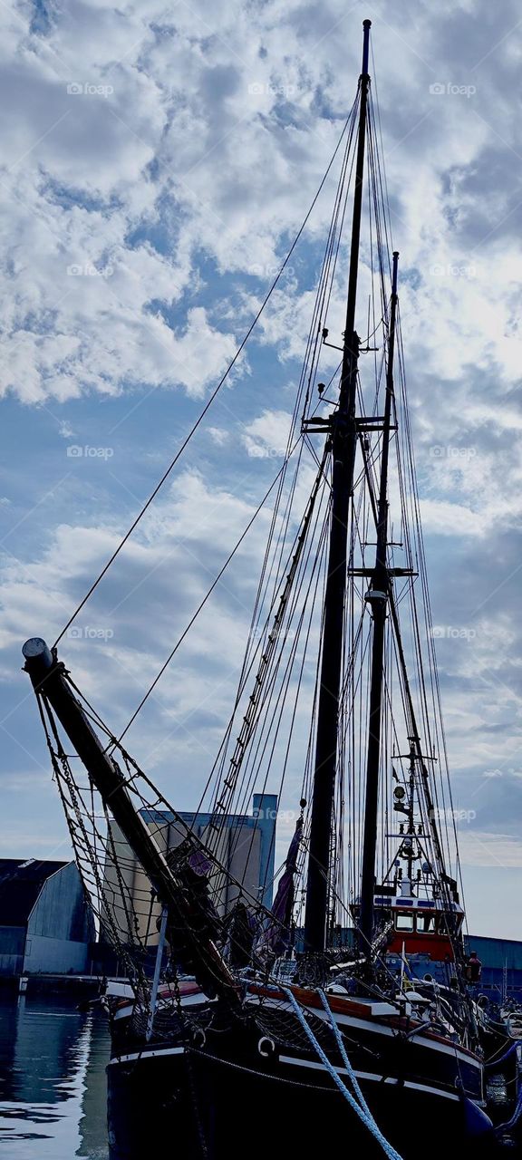 This is one of the very large traditional sailboats moored on the shore of the “Baltic Sea” by the small town of “Ystad” in “Sweden”. 2023. Hypnotic Productions