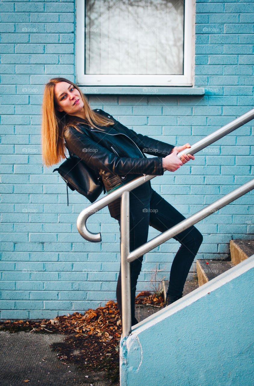 Girl in black jacket and jeans