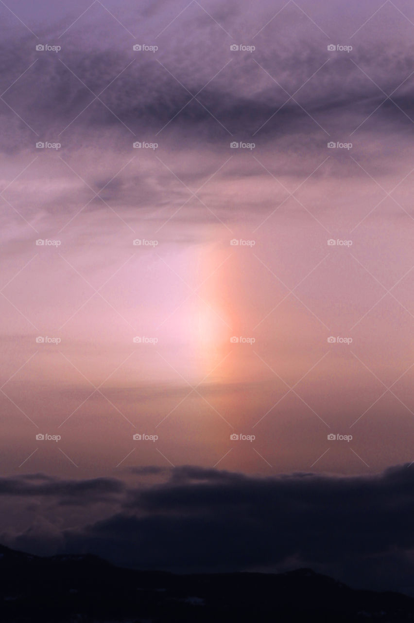 Captured an interesting sky at sunset tonight. Interesting clouds and a beautiful sun dog (parhelion). Playing with the light and filters to enhance the already beautiful event! 