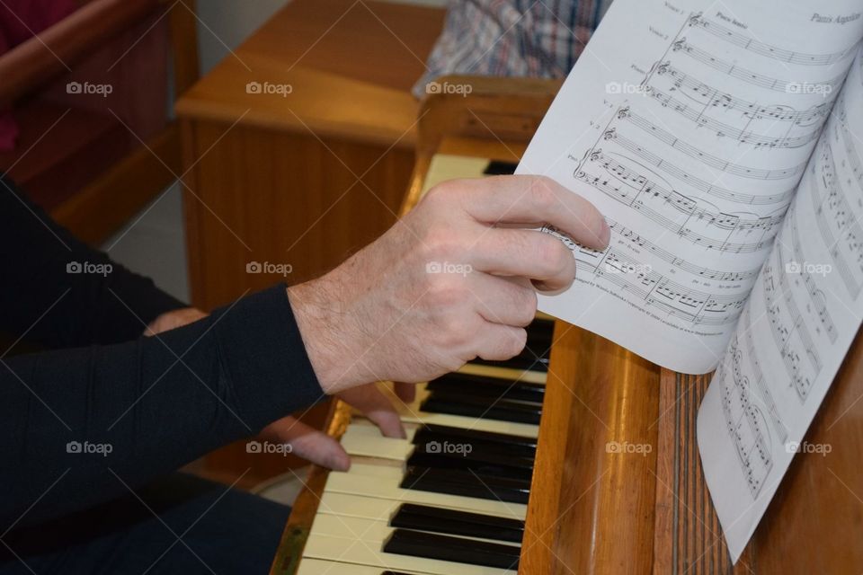 playing music at a piano 