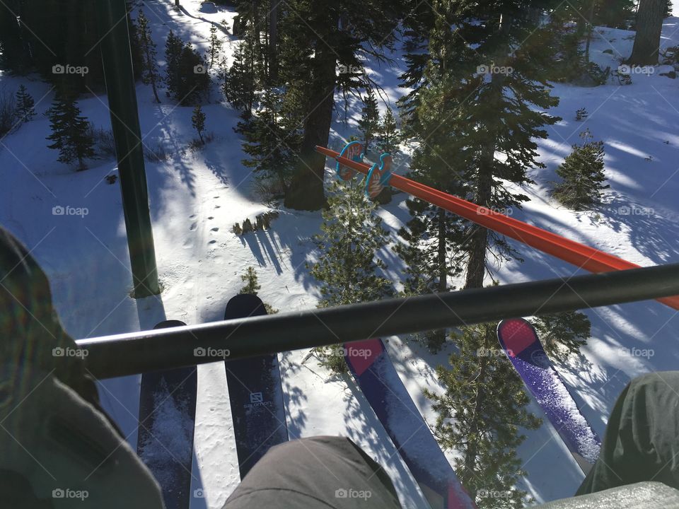 Photo from a chair lift of skis