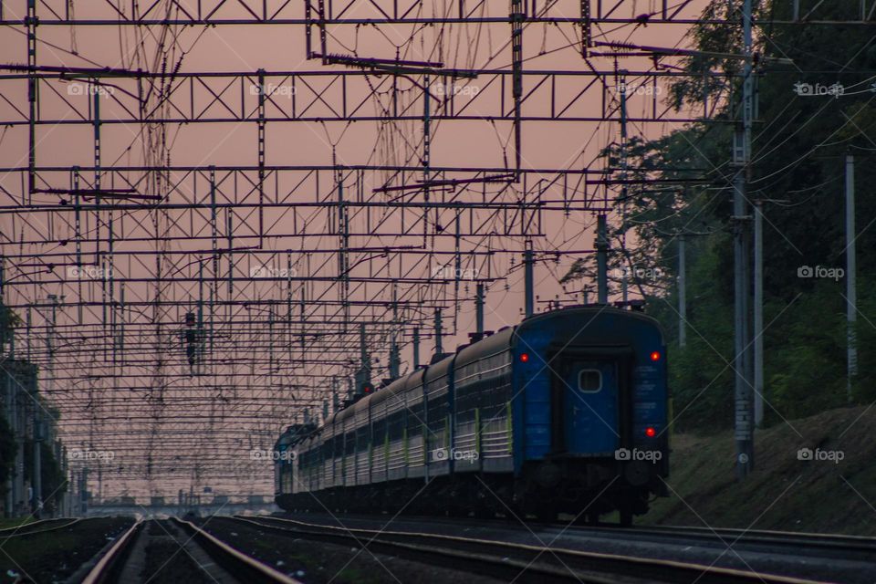 A passenger train rolling to sunset 😍