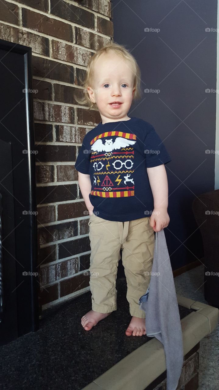 toddler posing in harry potter shirt