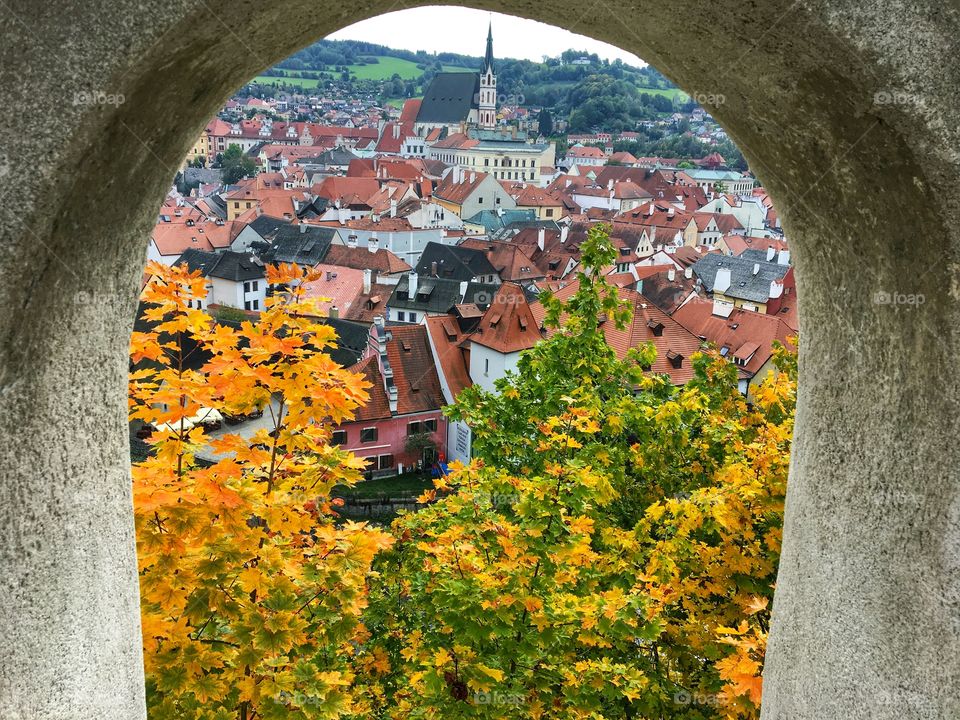 Landscape of Cesky Krumlov ... through an arched window ... love the autumn leaves 