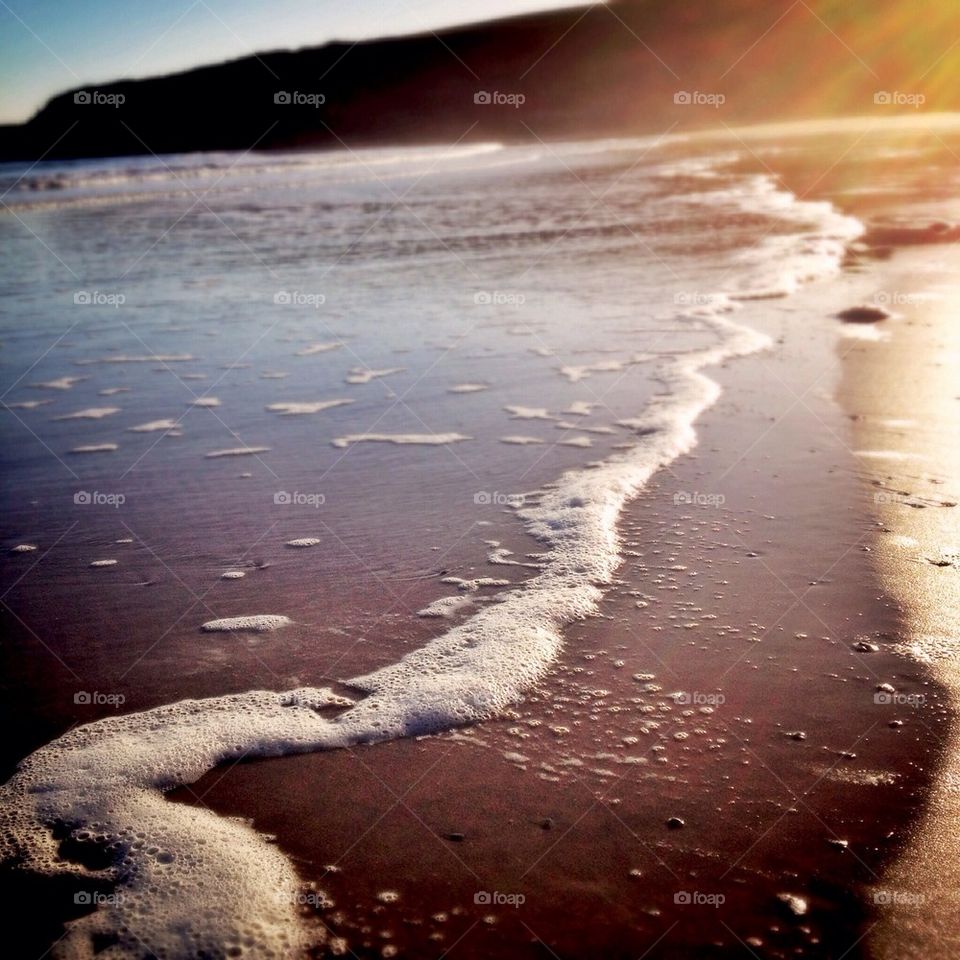 Close-up of tide on beach