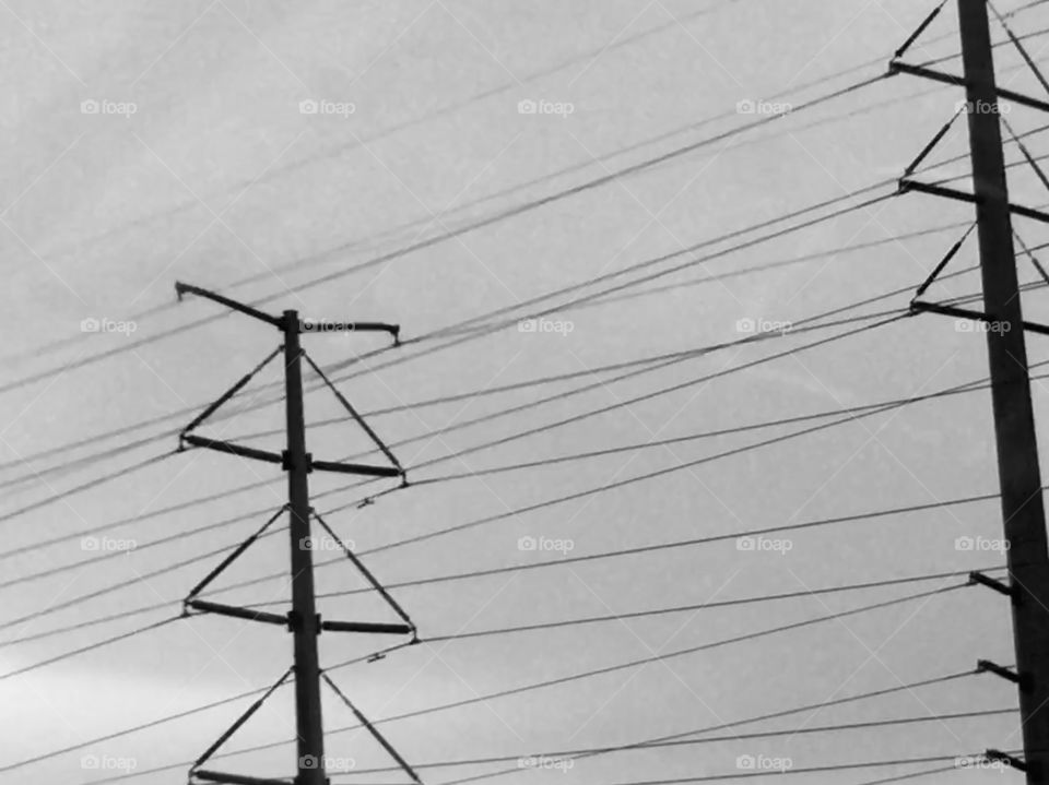 Iron giants and power lines in black and white 