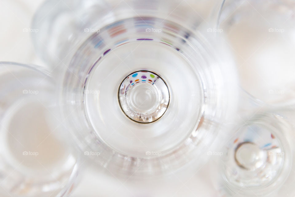 Ellipse and circle shapes using glass and reflection in the glass. Clean simple lines on a white background. Circles reflecting inside the glass.