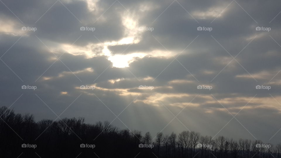 sun rays through the clouds