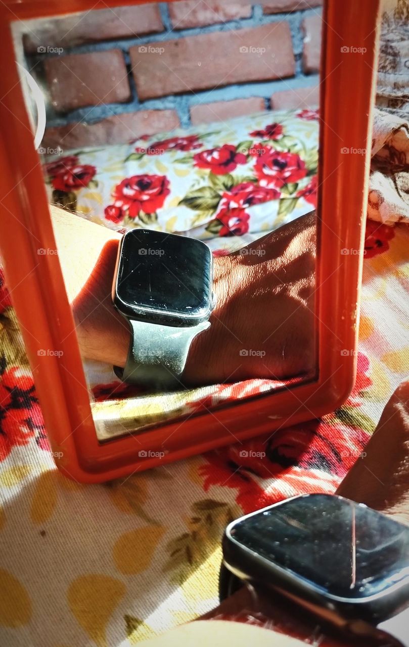 a black watch banding on wrist