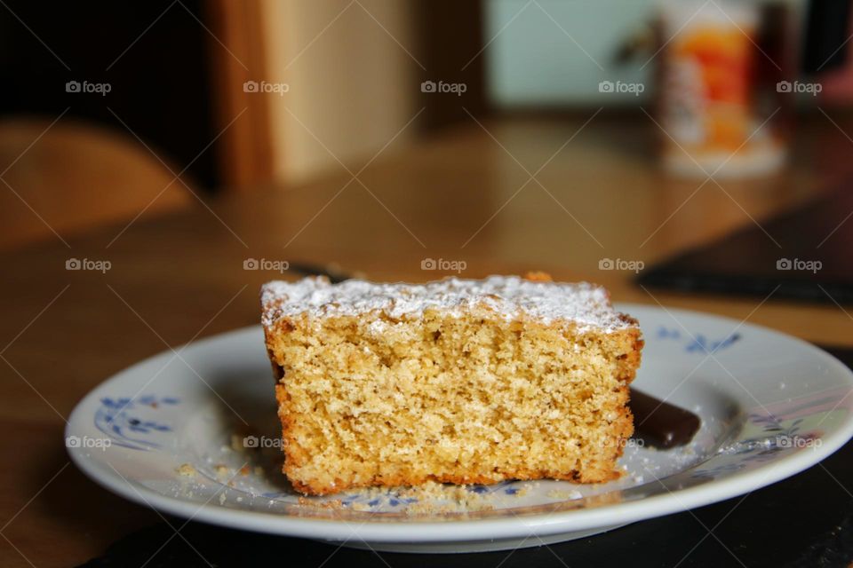 Close up of a piece of cake on plate in kitchen 