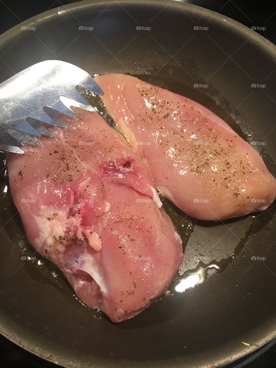 Raw chicken in the pan 