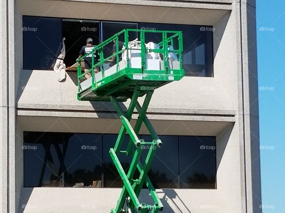 Contractors remove garbage from an office building.