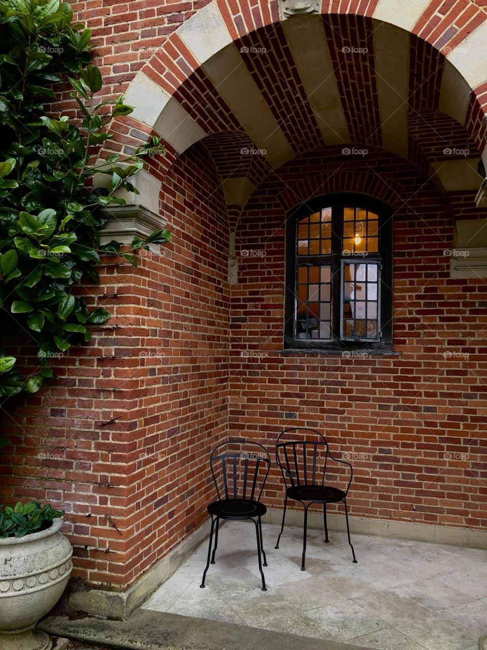 Lit window and brick wall 