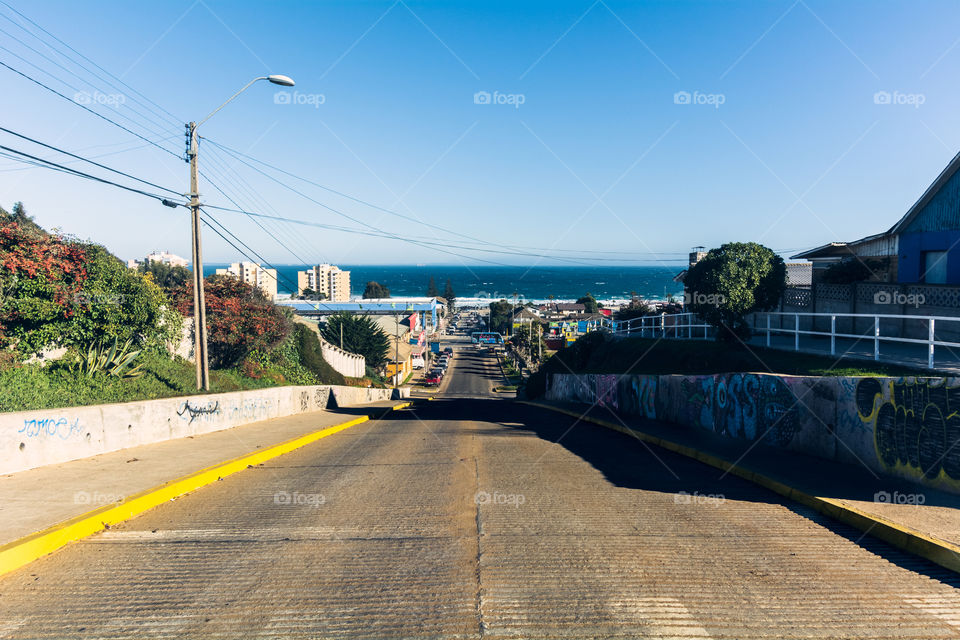 Street photography of the streets of El Tabo a small town in the Chile’s coast with the Pacific Ocean in the background 