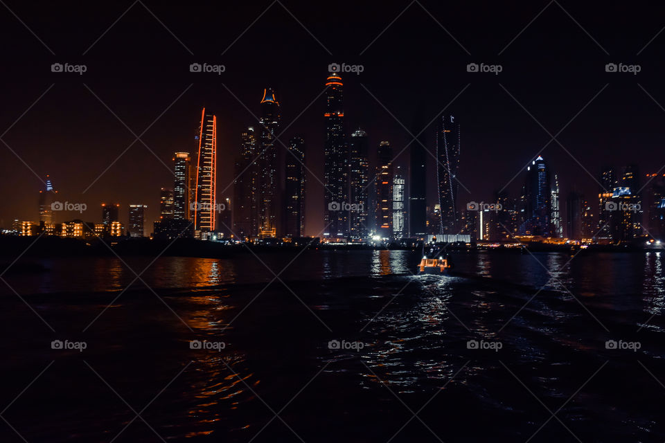 DUBAI, UNITED ARAB EMIRATES - UAE - Asia 23 APRIL 2016: Skyscrapers of City Marina at night. Panoramic skyline view lights and reflections. Famous for expensive property, high-end luxurious star hotel