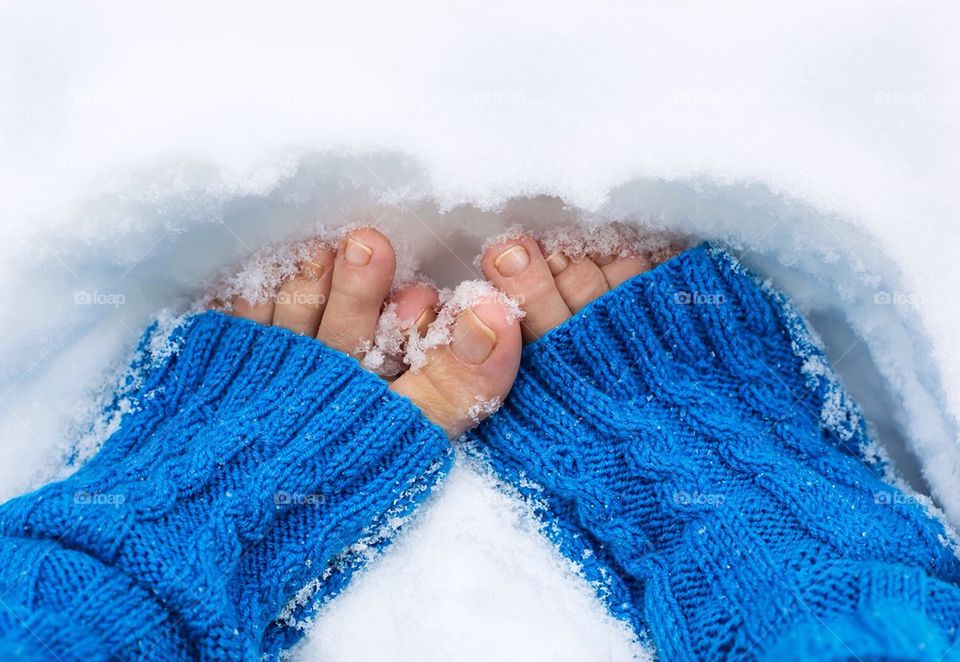 Close-up of a woman's feet on snow